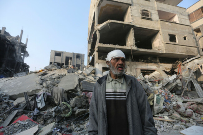 a-palestinian-stands-outside-the-building-destroyed-i-the-israeli-bombardment-of-the-gaza-strip-in-rafah-wednesday-oct-25-2023-ap-photohatem-ali