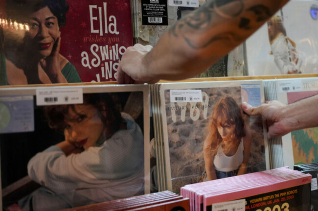 an-employee-of-plaid-room-records-stocks-a-shelf-with-the-re-recorded-version-of-taylor-swifts-album-1989-friday-oct-27-2023-in-loveland-ohio-the-album-1989-taylors-version-released-to-th