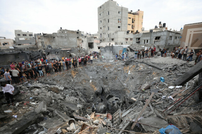 palestinians-inspect-the-rubble-of-a-destroyed-building-after-an-israeli-airstrike-in-deir-al-balah-gaza-strip-friday-oct-27-2023-ap-photoali-mahmoud