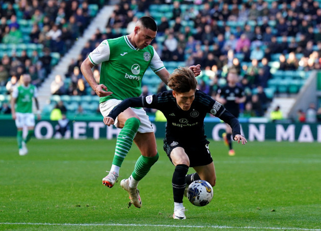 celtics-kyogo-furuhashi-right-and-hibernians-lewis-miller-battle-for-the-ball-during-the-cinch-premiership-match-at-easter-road-stadium-edinburgh-picture-date-saturday-october-28-2023