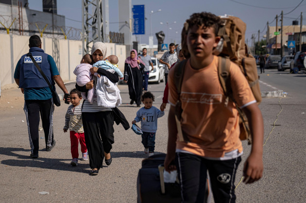 palestinians-arrive-at-rafah-the-border-crossing-between-the-gaza-strip-and-egypt-on-wednesday-nov-1-2023-ap-photofatima-shbair