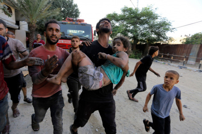 palestinians-carry-a-wounded-girl-after-being-rescued-from-under-the-rubble-of-buildings-that-were-destroyed-by-israeli-airstrikes-in-jabaliya-refugee-camp-northern-gaza-strip-wednesday-nov-1-202