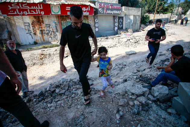 jenin-palestine-01st-nov-2023-palestinians-inspect-the-damage-of-the-buildings-and-streets-following-an-israeli-military-raid-in-jenin-refugee-camp-in-the-occupied-northern-west-bank-according-to