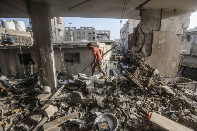 khan-yunis-palestinian-territories-03rd-nov-2023-a-palestinian-man-inspects-the-damaged-home-of-the-palestine-tv-journalist-muhammad-abu-hatab-who-was-killed-along-with-his-family-members-during