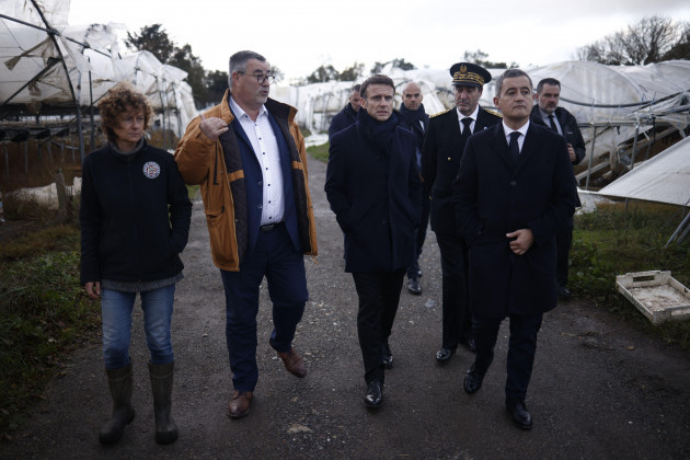daoulas-france-03rd-nov-2023-french-president-emmanuel-macron-c-flanked-by-alain-espinasse-prefect-of-finistere-and-french-interior-minister-gerald-darmanin-visits-a-farm-during-a-visit-after-s