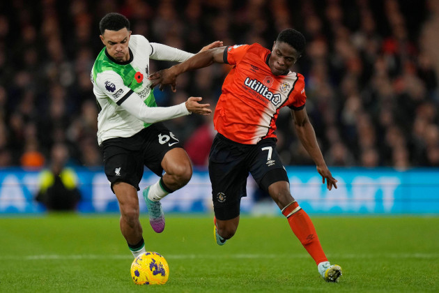 liverpools-trent-alexander-arnold-left-challenges-for-the-ball-with-luton-towns-chiedozie-ogbene-during-the-english-premier-league-soccer-match-between-luton-town-and-liverpool-at-kenilworth-road