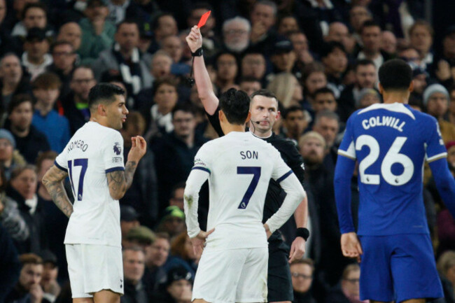 referee-michael-oliver-shows-a-red-card-to-tottenhams-cristian-romero-during-the-english-premier-league-soccer-match-between-tottenham-hotspur-and-chelsea-at-tottenham-hotspur-stadium-london-monda