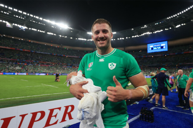 stuart-mccloskey-with-his-newborn-baby-after-the-game