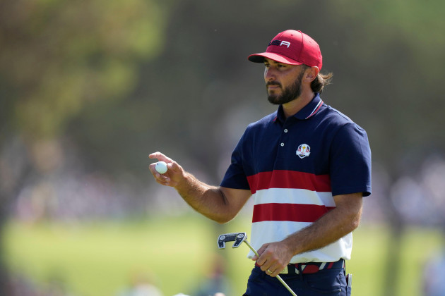 united-states-max-homa-acknowledges-the-crowd-on-the-1st-green-during-his-singles-match-at-the-ryder-cup-golf-tournament-at-the-marco-simone-golf-club-in-guidonia-montecelio-italy-sunday-oct-1-2