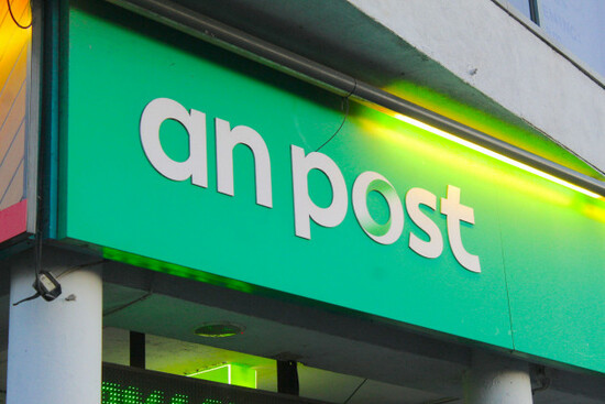 a-photo-of-a-green-an-post-sign-in-dublin-ireland