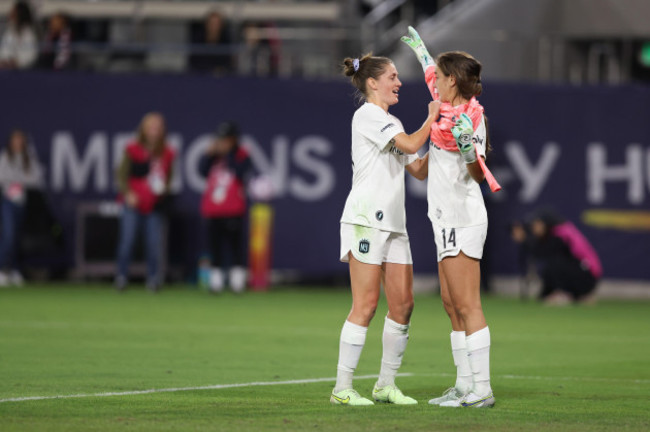 november-11-2023-san-diego-california-usa-njny-gotham-fc-midfielder-sinead-farrelly-33-helps-defender-nealy-martin-14-put-on-a-goalkeeper-kit-during-a-nwsl-championship-match-between-ol-reig