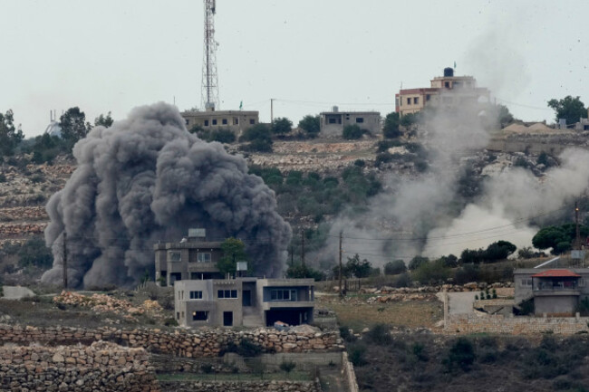 smoke-rises-from-an-israeli-airstrike-left-and-artillery-shelling-right-on-the-outskirts-of-aita-al-shaab-a-lebanese-border-village-with-israel-in-south-lebanon-monday-nov-13-2023-israeli-tr