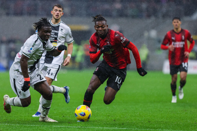 milan-italy-04th-nov-2023-rafael-leao-of-ac-milan-r-competes-for-the-ball-with-festy-ebosele-of-udinese-calcio-l-during-serie-a-202324-football-match-between-ac-milan-and-udinese-calcio-at-sa