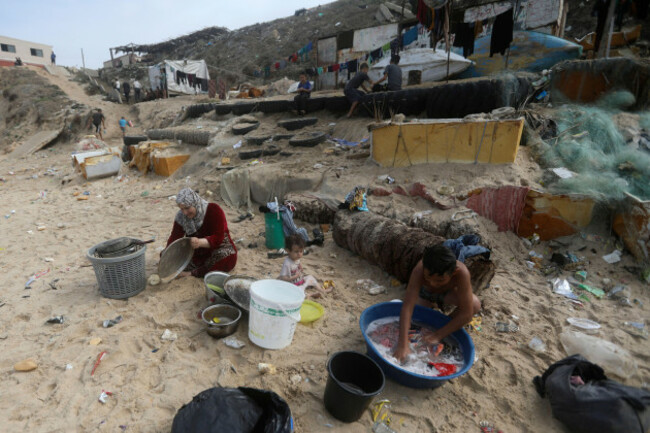 file-palestinians-resort-to-the-sea-water-to-bathe-and-clean-their-tools-and-clothes-due-the-continuing-water-shortage-in-the-gaza-strip-on-the-beach-of-deir-al-balah-central-gaza-strip-on-oct-29