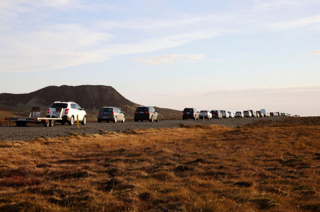 a-line-of-cars-queued-on-a-road-heading-to-the-town-of-grindavik-iceland-monday-nov-13-2023-residents-of-grindavik-a-town-in-southwestern-iceland-have-been-briefly-allowed-to-return-to-their-hom