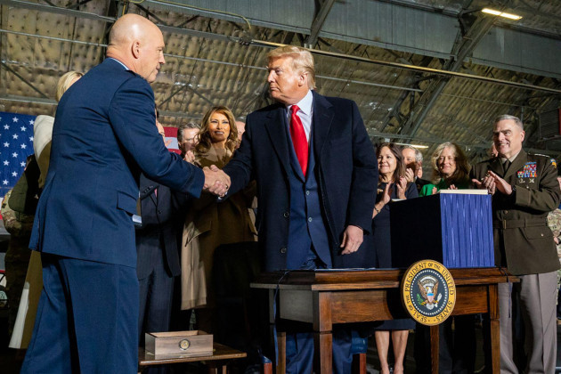 president-donald-trump-greets-gen-jay-raymond-after-being-named-the-first-chief-of-space-operations-and-first-member-of-the-united-states-space-force-friday-dec-20-2019-at-hangar-6-at-joint-base-and