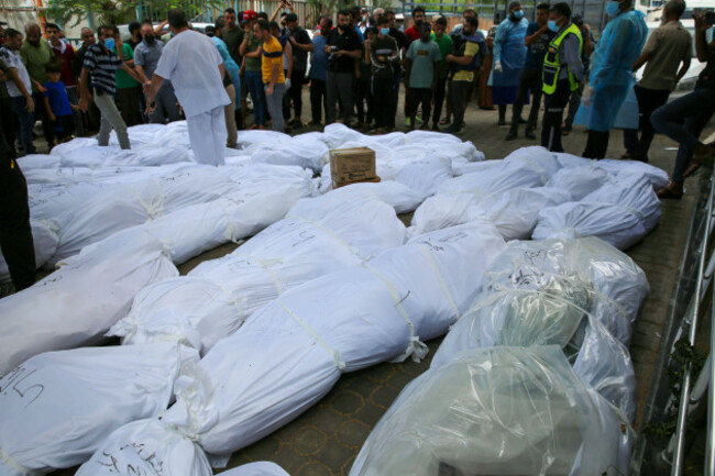 people-carry-out-dead-bodies-of-palestinians-who-lost-their-lives-during-the-attacks-of-israel-from-the-shifa-hospital-people-carry-out-dead-bodies-of-palestinians-who-lost-their-lives-during-the-a