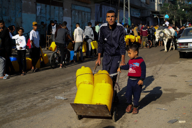 palestinians-line-to-collect-water-during-the-ongoing-israeli-bombardment-of-the-gaza-strip-in-rafah-on-saturday-nov-18-2023-ap-photohatem-ali