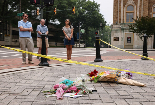 community-members-pay-their-respects-at-an-impromptu-memorial-at-monroe-park-where-18-year-old-high-school-graduate-shawn-jackson-and-his-father-36-year-old-renzo-smith-were-gunned-down-following-the