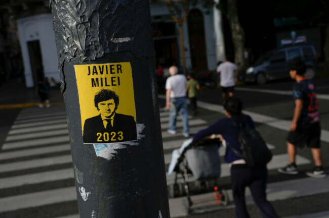 a-campaign-poster-promoting-the-liberty-advances-coalition-candidate-javier-milei-is-displayed-on-a-pole-a-day-ahead-of-the-presidential-runoff-in-buenos-aires-argentina-saturday-nov-18-2023-a