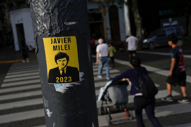 a-campaign-poster-promoting-the-liberty-advances-coalition-candidate-javier-milei-is-displayed-on-a-pole-a-day-ahead-of-the-presidential-runoff-in-buenos-aires-argentina-saturday-nov-18-2023-a