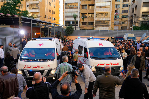 journalists-and-family-members-gather-next-to-lebanese-red-cross-ambulances-carrying-the-bodies-of-the-two-slain-journalists-of-pan-arab-tv-network-al-mayadeenm-who-were-killed-by-an-israeli-strike-o