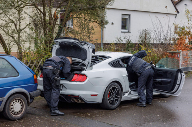 police-officers-search-a-car-during-a-raid-in-garbsen-germany-thursday-nov-23-2023-around-280-police-officers-have-searched-several-properties-in-eight-german-states-in-connection-with-investiga