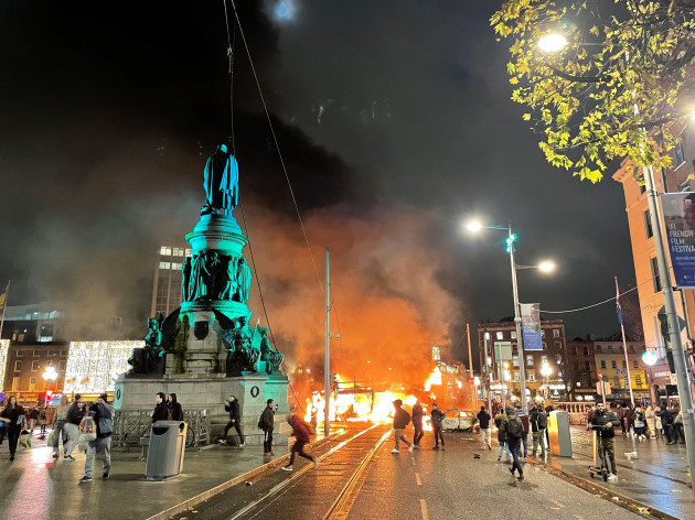 a-bus-and-car-on-fire-on-oconnell-street-in-dublin-city-centre-after-violent-scenes-unfolded-following-an-attack-on-parnell-square-east-where-five-people-were-injured-including-three-young-children