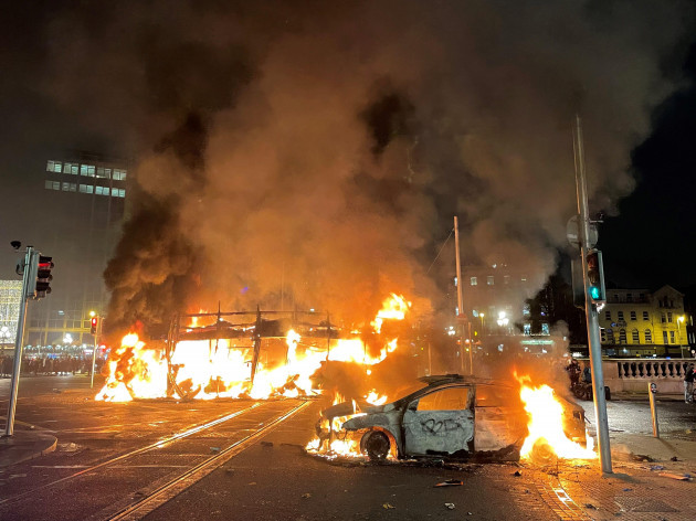 a-bus-and-car-on-fire-on-oconnell-street-in-dublin-city-centre-after-violent-scenes-unfolded-following-an-attack-on-parnell-square-east-where-five-people-were-injured-including-three-young-children