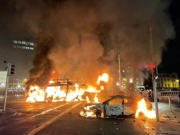 a-bus-and-car-on-fire-on-oconnell-street-in-dublin-city-centre-after-violent-scenes-unfolded-following-an-attack-on-parnell-square-east-where-five-people-were-injured-including-three-young-children