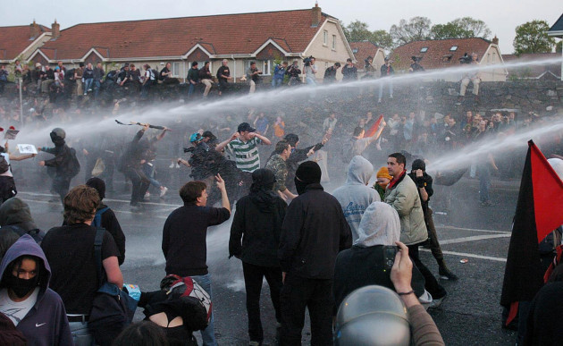 irish-police-use-water-cannon-to-subdue-protesters-gathered-outside-phoenix-park-where-the-ceremony-for-eu-enlargement-took-place-earlier-today