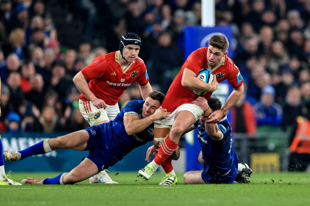 jack-crowley-is-tackled-by-jordan-larmour-and-robbie-henshaw