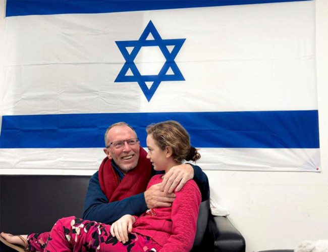 in-this-photo-provided-by-the-israeli-army-emily-hand-a-released-hostage-reunites-with-her-father-sunday-nov-26-2023-in-israel-the-tense-cease-fire-between-israel-and-hamas-appeared-to-be-back