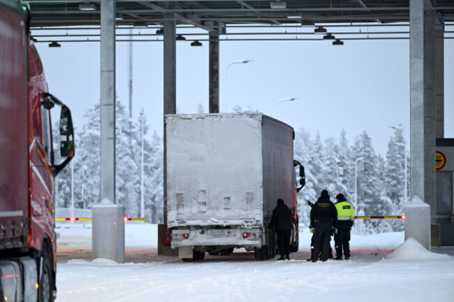 finnish-border-guards-and-a-customs-official-check-a-truck-at-the-raja-jooseppi-international-border-crossing-station-in-inari-northern-finland-tuesday-nov-28-2023-finland-will-close-its-last-rem