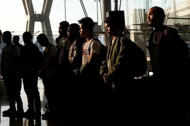 thai-hostages-who-were-freed-from-hamas-observe-a-minute-of-silence-upon-their-arrival-at-suvarnabhumi-international-airport-in-samut-prakarn-province-thailand-thursday-nov-30-2023-twenty-three