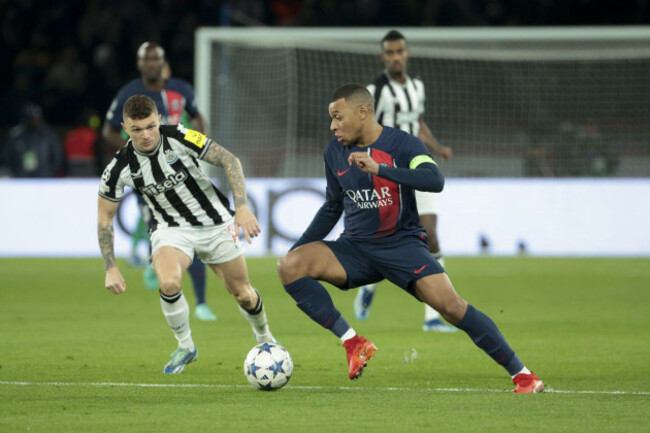 paris-france-november-28-2023-paris-france-november-28-2023-kylian-mbappe-of-psg-left-kieran-trippier-of-newcastle-in-action-during-the-uefa-champions-league-group-f-football-match-between-pa