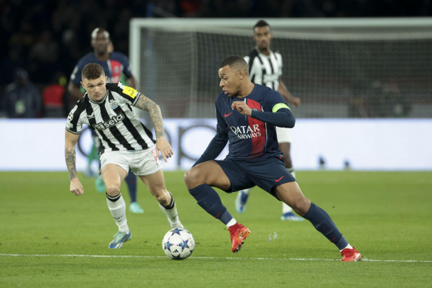 paris-france-november-28-2023-paris-france-november-28-2023-kylian-mbappe-of-psg-left-kieran-trippier-of-newcastle-in-action-during-the-uefa-champions-league-group-f-football-match-between-pa