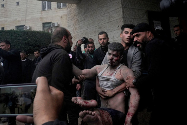 palestinians-wounded-in-the-israeli-bombardment-of-the-gaza-strip-are-brought-to-the-hospital-in-deir-al-balah-on-tuesday-dec-5-2023-ap-photo-hatem-moussa