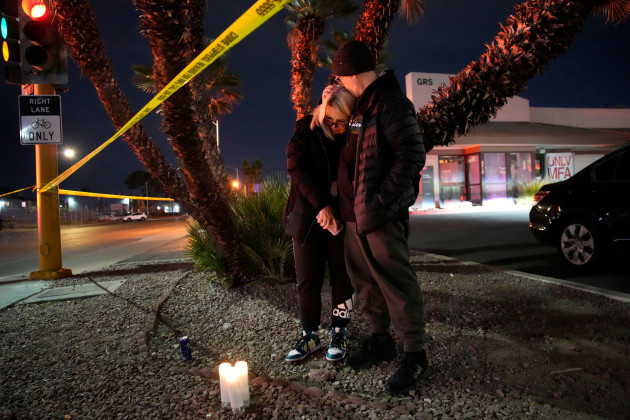 sean-hathcock-right-kisses-michelle-ashley-after-the-two-left-candles-for-victims-of-a-shooting-at-the-university-of-nevada-las-vegas-wednesday-dec-6-2023-in-las-vegas-the-two-graduated-from