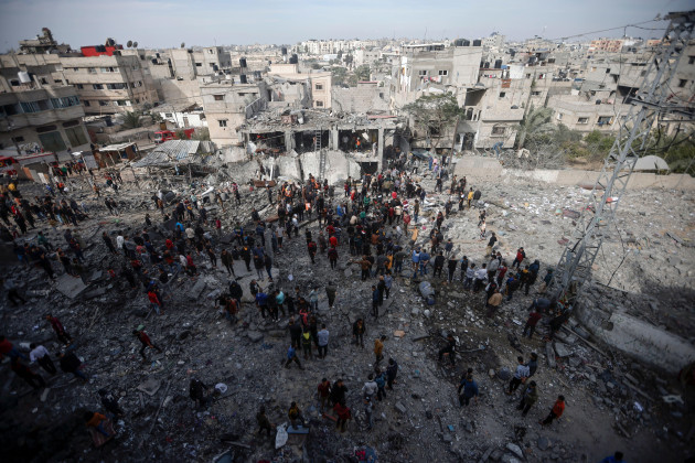 palestinians-inspect-the-damage-of-a-destroyed-building-following-israeli-airstrikes-in-khan-younis-refugee-camp-southern-gaza-strip-thursday-dec-7-2023-ap-photomohammed-dahman