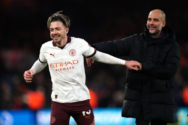 manchester-citys-jack-grealish-left-and-manager-pep-guardiola-celebrate-victory-after-the-final-whistle-in-the-premier-league-match-at-kenilworth-road-luton-picture-date-sunday-december-10-2023