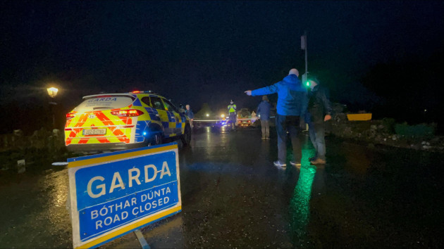 gardai-at-leitrim-village-in-co-as-high-winds-flattened-trees-ripped-a-roof-off-a-building-and-left-debris-scattered-on-a-street-after-a-possible-tornado-hit-the-area-picture-date-sunday-december