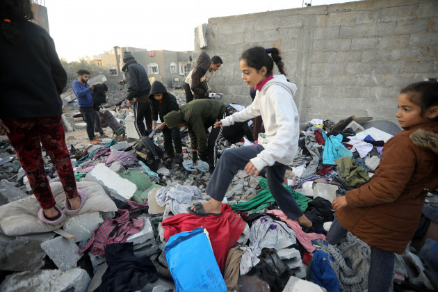 rafah-gaza-11th-dec-2023-people-search-house-rubble-for-items-to-salvage-following-an-early-morning-israeli-strike-in-rafah-in-the-southern-gaza-strip-on-tuesday-december-12-2023-at-least-22-p