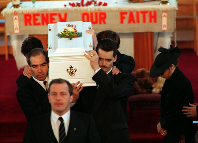 denise-bulger-hangs-her-head-as-her-husband-ralph-right-carries-the-coffin-of-their-two-year-old-son-james-from-the-sacred-heart-church-in-kirkby
