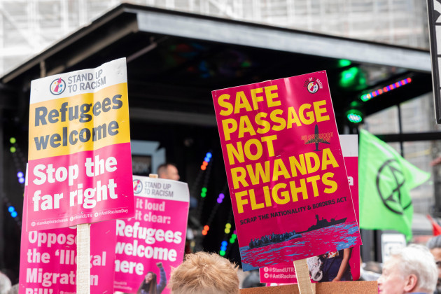 protest-taking-place-in-london-on-un-anti-racism-day-stand-up-to-racism-rwanda-flights-placard