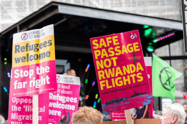 protest-taking-place-in-london-on-un-anti-racism-day-stand-up-to-racism-rwanda-flights-placard