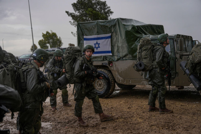 israeli-soldiers-prepare-to-enter-the-gaza-strip-at-a-staging-area-near-the-israeli-gaza-border-in-southern-israel-wednesday-dec-13-2023-the-army-is-battling-palestinian-militants-across-gaza-i