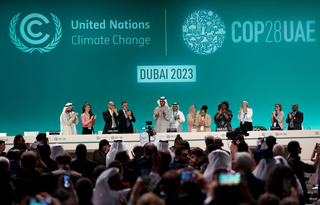 dubai-united-arab-emiratesuae-13th-dec-2023-attendees-applaud-after-announcement-of-uae-consensus-during-a-closing-plenary-of-cop28-or-the-28th-session-of-the-conference-of-the-parties-to-the-u