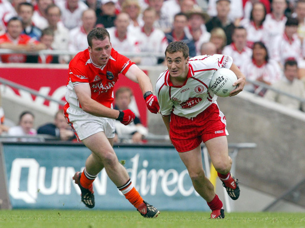 brian-mcguigan-of-tyrone-gets-away-from-ciaran-mckeever-of-armagh