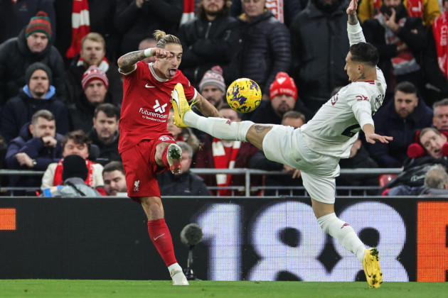 liverpool-uk-17th-dec-2023-kostas-tsimikas-of-liverpool-clears-from-antony-of-manchester-united-during-the-premier-league-match-liverpool-vs-manchester-united-at-anfield-liverpool-united-kingdom